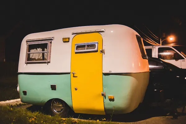 A Mini Camper Trailer parked to camp.